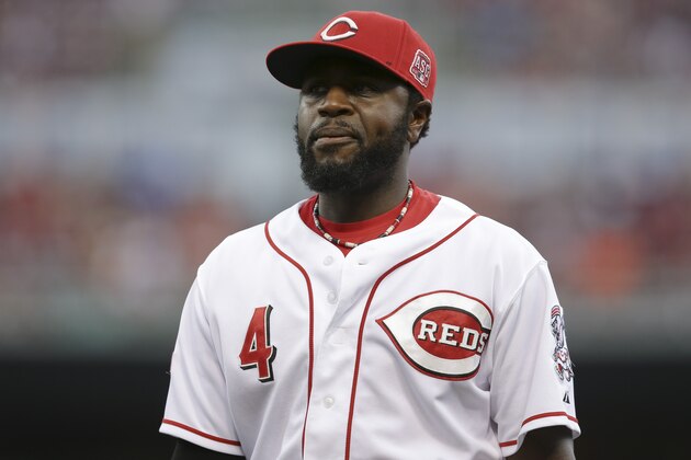 Cincinnati Reds second baseman Brandon Phillips (4) walks back to the dugout in the third inning of a baseball game against the Detroit Tigers, Wednesday, June 17, 2015, in Cincinnati. The Reds won 8-4. (AP Photo/John Minchillo)