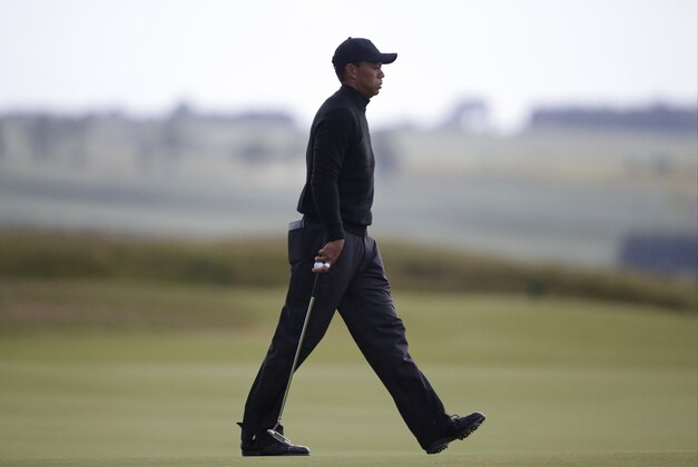 United States’ Tiger Woods walks on the 8th green during the second round of the British Open Golf Championship at the Old Course, St. Andrews, Scotland, Friday, July 17, 2015. (AP Photo/Alastair Grant)
