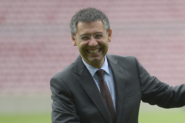 FC Barcelona president Josep Maria Bartomeu  left, shakes hands with Luis Enrique during his official presentation as new coach of FC Barcelona at the Camp Nou stadium in Barcelona, Spain, Wednesday, May 21, 2014. Former Barcelona player Luis Enrique signed a two-year contract to become coach on Wednesday, a hire the club hopes will resemble the success stories of Johan Cruyff and Pep Guardiola. (AP Photo/Manu Fernandez)