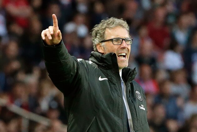 Paris Saint Germain's coach Laurent Blanc, gestures during the League One soccer match between Paris Saint Germain and Guingamp, at the Parc des Princes stadium, in Paris, France, Friday, May 8, 2015. (AP Photo/Thibault Camus)