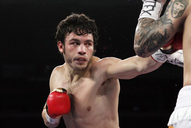 Mar 1, 2014; San Antonio, TX, USA; Bryan Vera (white trunks) trades punches with Julio Cesar Chavez, Jr. during their vacant WBC continental americas super middleweight title bout at Alamodome. Mandatory Credit: Soobum Im-USA TODAY Sports