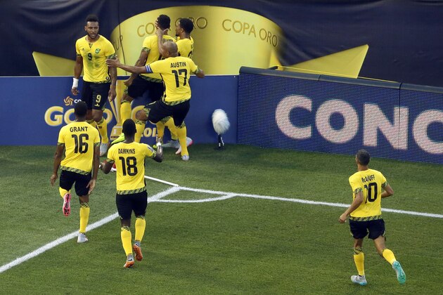 Jamaica's Giles Barnes, top left, celebrates with teammates after scoring a goal during the first half of a CONCACAF Gold Cup soccer quarterfinal against Haiti, Saturday, July 18, 2015, in Baltimore. (AP Photo/Patrick Semansky)