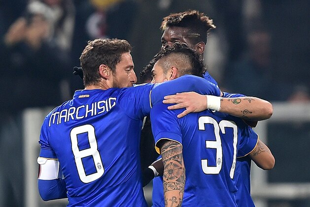 Juventus Argentine forward Roberto Pereyra, number 37, celebrates with teammates Claudio Marchisio, left, and Paul Pogba after scoring, during an Italian Cup, round of sixteen soccer match between Juventus and Verona at the Turin Juventus stadium, Italy, Thursday, Jan. 15, 2015. (AP Photo/Alessandro Di Marco, Ansa)