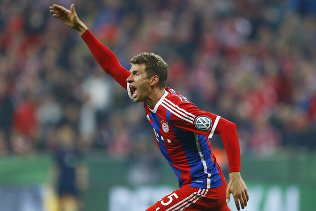 Bayern's Thomas Mueller reacts during the German soccer cup (DFB Pokal) semifinal match between FC Bayern Munich and Borussia Dortmund at the Allianz Arena in Munich, Germany, on Tuesday, April 28, 2015. (AP Photo/Matthias Schrader)