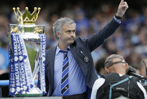 FILE - In this May 24, 2015 file photo Chelsea Manager Jose Mourinho waves to the crowd after the English Premier League soccer match between Chelsea and Sunderland at Stamford Bridge stadium in London. Chelsea were awarded the trophy after winning the English Premier League. (AP Photo/Tim Ireland, file)