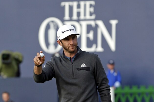 United States’ Dustin Johnson gestures to the crowd after putting on the 18th green during the second round of the British Open Golf Championship at the Old Course, St. Andrews, Scotland, Saturday, July 18, 2015. (AP Photo/David J. Phillip)