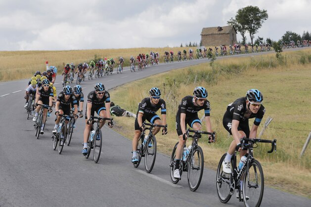 Team Sky with Britain's Luke Rowe, Wout Poels of the Netherlands, Ireland's Nicolas Roche, Britain's Ian Stannard, Australia's Richie Porte, Leopold Konig of the Czech Republic, Britain's Geraint Thomas, and Britain's Chris Froome, wearing the overall leader's yellow jersey, from front to rear, leads the pack during the fifteenth stage of the Tour de France cycling race over 183 kilometers (113.7 miles) with start in Mende and finish in Valence, France, Sunday, July 19, 2015. (AP Photo/Laurent Cipriani) Team Sky with Britain's Luke Rowe, Wout Poels of the Netherlands, Ireland's Nicolas Roche, Britain's Ian Stannard, Australia's Richie Porte, Leopold Konig of the Czech Republic, Britain's Geraint Thomas, and Britain's Chris Froome, wearing the overall leader's yellow jersey, from front to rear, leads the pack during the fifteenth stage of the Tour de France cycling race over 183 kilometers (113.7 miles) with start in Mende and finish in Valence, France, Sunday, July 19, 2015. (AP Photo/Laurent Cipriani)
