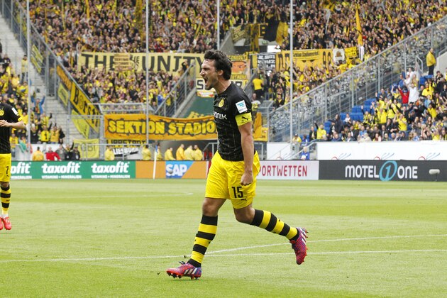 Dortmund's scorer Mats Hummels celebrates his side's first goal during a German first division Bundesliga soccer match between TSG 1899 Hoffenheim and Borussia Dortmund in Sinsheim, Germany, Saturday, May 2, 2015. (AP Photo/Michael Probst)