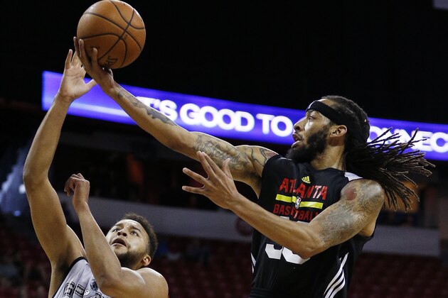 Atlanta Hawks’ Terran Petteway shoots over San Antonio Spurs’ Kyle Anderson during the first half of an NBA summer league basketball game Sunday, July 19, 2015, in Las Vegas. (AP Photo/John Locher)