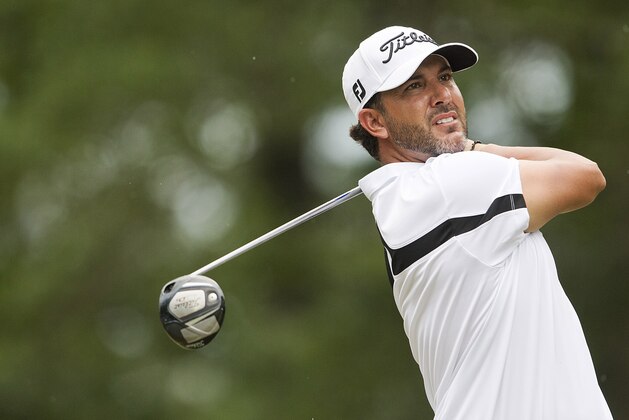 Scott Piercy tees off on the fourth hole during the final round of the Barbasol Championship golf tournament Sunday, July 19, 2015, in Opelika, Ala. (AP Photo/Butch Dill)
