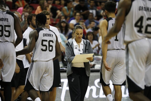 Becky Hammon coaches the San Antonio Spurs against the Atlanta Hawks during the second half of an NBA summer league basketball game Sunday, July 19, 2015, in Las Vegas. (AP Photo/John Locher)