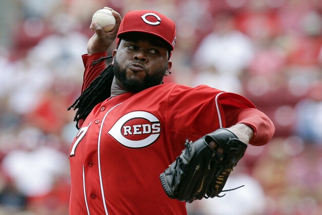 Cincinnati Reds starting pitcher Johnny Cueto throws in the first inning of a baseball game against the Cleveland Indians, Sunday, July 19, 2015, in Cincinnati. (AP Photo/John Minchillo)