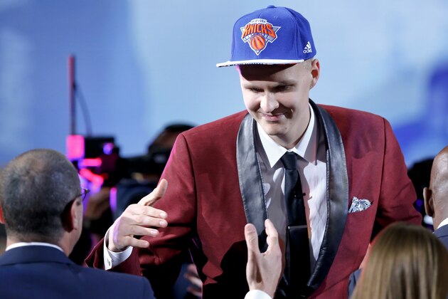 Kristaps Porzingis is congratulated by supporters after being selected fourth overall by the New York Knicks during the NBA basketball draft, Thursday, June 25, 2015, in New York. (AP Photo/Kathy Willens)
