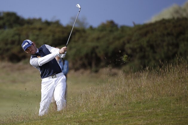 South Africa’ Louis Oosthuizen plays from the rough on the 16th hole during the third round of the British Open Golf Championship at the Old Course, St. Andrews, Scotland, Sunday, July 19, 2015. (AP Photo/Jon Super)