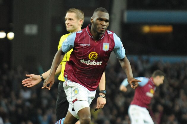 Villa's Christian Benteke celebrates after scoring his third goal against QPR during the English Premier League soccer match between Aston Villa and Queens Park Rangers at Villa Park, Birmingham, England, Tuesday, April 7, 2015. (AP Photo/Rui Vieira)