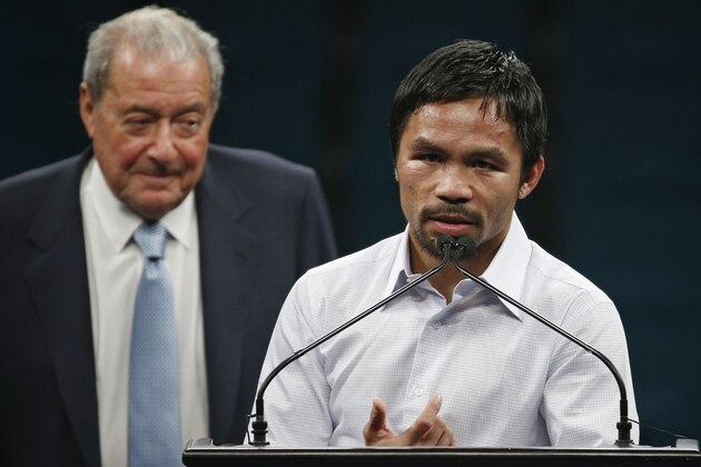 Promoter Bob Arum, left, watches as Manny Pacquiao answers reporter questions during a press conference following his welterweight title fight on Saturday, May 2, 2015 in Las Vegas. Floyd Mayweather defeated Pacquiao in a unanimous decision. (AP Photo/John Locher) Promoter Bob Arum, left, watches as Manny Pacquiao answers reporter questions during a press conference following his welterweight title fight on Saturday, May 2, 2015 in Las Vegas. Floyd Mayweather defeated Pacquiao in a unanimous decision. (AP Photo/John Locher)