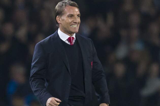 Liverpool's manager Brendan Rodgers smiles after his team's 1-0 win against Blackburn in their English FA Cup sixth round replay soccer match at Ewood Park Stadium, Blackburn, England, Wednesday, April 8, 2015. (AP Photo/Jon Super)