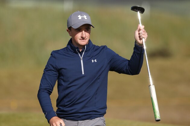 Ireland’s Paul Dunne gestures after a birdie on the 15th during the third round at the British Open Golf Championship at the Old Course, St. Andrews, Scotland, Sunday, July 19, 2015. (AP Photo/Jon Super)