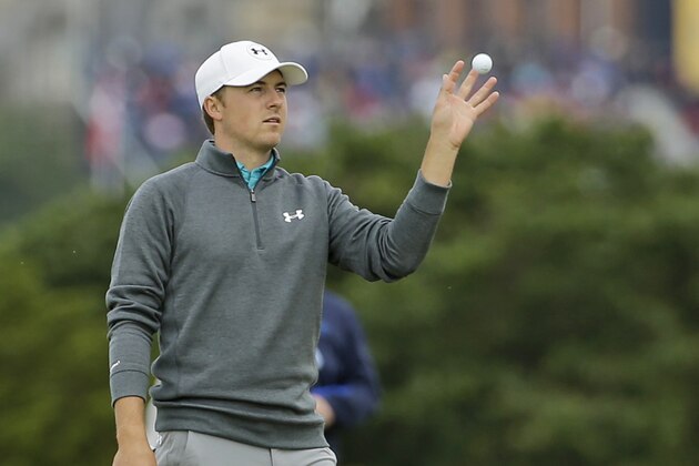 United States’ Jordan Spieth catches the ball from his caddie on the 16th green during the third round at the British Open Golf Championship at the Old Course, St. Andrews, Scotland, Sunday, July 19, 2015. (AP Photo/David J. Phillip)