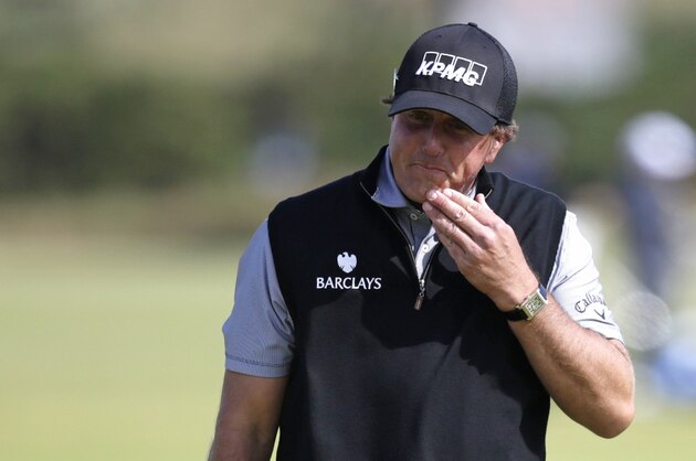 United States’ Phil Mickelson reacts as he drops two shots on the 11th green during the second round of the British Open Golf Championship at the Old Course, St. Andrews, Scotland, Friday, July 17, 2015. (AP Photo/Alastair Grant)