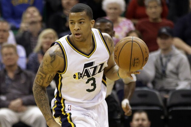 Utah Jazz guard Trey Burke (3) brings the ball up court in the third quarter in an NBA basketball game against the Washington Wizards Wednesday, March 18, 2015, in Salt Lake City. The Wizards won 88-84. (AP Photo/Rick Bowmer)