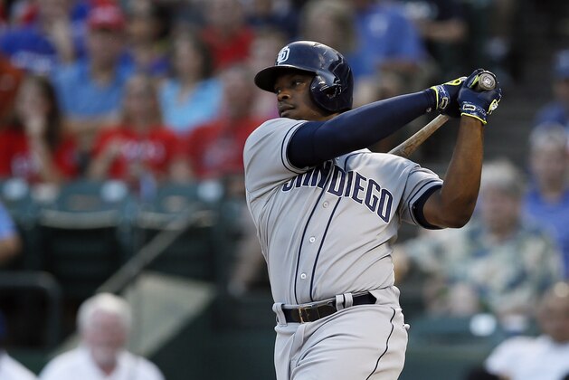 San Diego Padres' Justin Upton follows through on a swing against the Texas Rangers in the first inning of an interleague baseball game Saturday, July 11, 2015, in Arlington, Texas. (AP Photo/Tony Gutierrez)