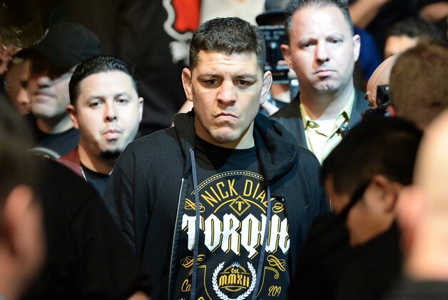 Jan 31, 2015; Las Vegas, NV, USA; Nick Diaz (blue gloves) walks to the ring before a middleweight fight against Anderson Silva (not pictured) during UFC 183 at the MGM Grand Garden Arena. Mandatory Credit: Jayne Kamin-Oncea-USA TODAY Sports