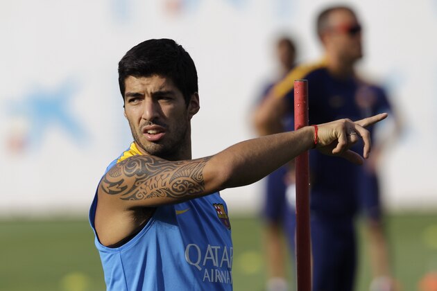 FC Barcelona's Luis Suarez, from Uruguay, gestures during a training session at the Sports Center FC Barcelona Joan Gamper in the San Joan Despi, Spain, Wednesday, July 15, 2015. (AP Photo/Manu Fernandez)