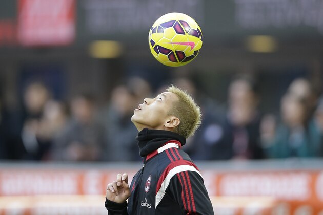 AC Milan's Keisuke Honda controls the ball during the Serie A soccer match between AC Milan and Cesena at the San Siro stadium in Milan, Italy, Sunday, Feb. 22, 2015. (AP Photo/Antonio Calanni)