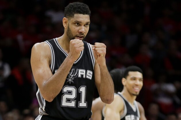 San Antonio Spurs forward Tim Duncan, right, celebrates a basket as Los Angeles Clippers guard J.J. Redick walks by  during the second half of Game 2 of a first-round NBA basketball playoff series in Los Angeles, Wednesday, April 22, 2015. The Spurs won 111-107 in overtime. (AP Photo/Chris Carlson)
