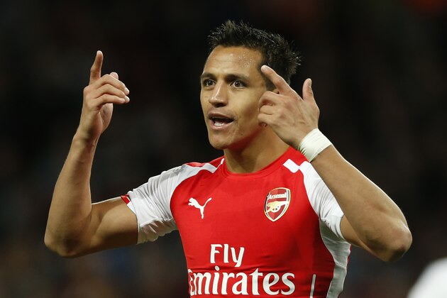 Arsenal's Alexis Sanchez gestures toward the assistant referee as he disputes a decision during their English Premier League soccer match between Arsenal and Swansea City at the Emirates stadium in London, Monday,May 11,  2015. (AP Photo/Alastair Grant)