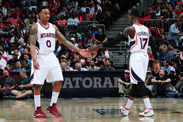ATLANTA, GA - APRIL 7:  Jeff Teague #0 and Dennis Schroder #17 of the Atlanta Hawks shake hands during the game against the Phoenix Suns on April 7, 2015 at Philips Arena in Atlanta, Georgia.  NOTE TO USER: User expressly acknowledges and agrees that, by downloading and/or using this Photograph, user is consenting to the terms and conditions of the Getty Images License Agreement. Mandatory Copyright Notice: Copyright 2015 NBAE (Photo by Scott Cunningham/NBAE via Getty Images)