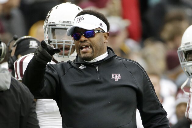Texas A&M head coach Kevin Sumlin yells at an official after safety Howard Matthews was ejected in the first half of the Liberty Bowl NCAA college football game against West Virginia, Monday, Dec. 29, 2014, in Memphis, Tenn. (AP Photo/Mark Humphrey)