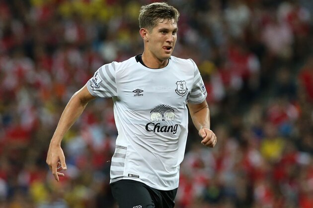 SINGAPORE - JULY 18:  John Stones of Everton dribbles the ball during the Barclays Asia Trophy match between Arsenal and Everton at the National Stadium on July 18, 2015 in Singapore.  (Photo by Lionel Ng/Getty Images)
