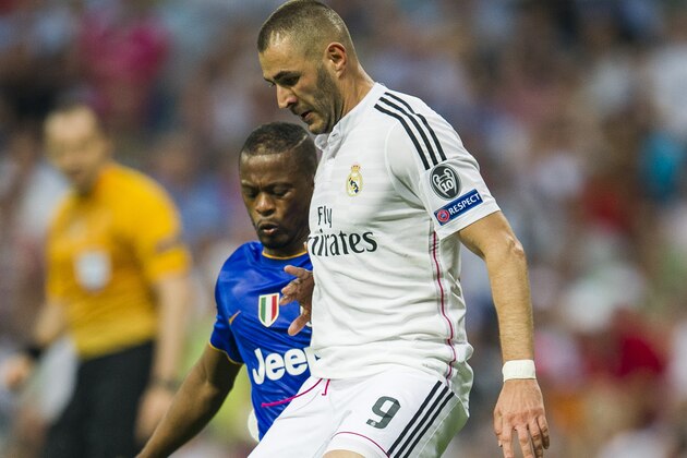 MADRID, SPAIN - MAY 13:  Karim Benzema of Real Madrid CF duels for the ball with Patrice Evra of Juventus during the UEFA Champions League semi final match between Real Madrid CF and Juventus at Estadio Santiago Bernabeu on May 13, 2015 in Madrid, Spain.  (Photo by Juan Manuel Serrano Arce/Getty Images)