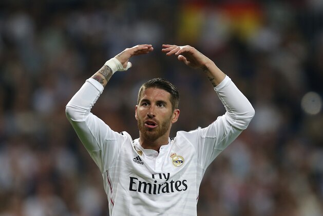 Real Madrid's Sergio Ramos gestures during the second leg quarterfinal Champions League soccer match between Real Madrid and Atletico Madrid at Santiago Bernabeu stadium in Madrid, Spain, Wednesday April 22, 2015. (AP Photo/Paul White)
