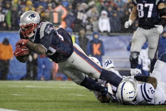 New England Patriots running back LeGarrette Blount (29) scores on a 13-yard touchdown run during the second half of the NFL football AFC Championship game against the Indianapolis Colts Sunday, Jan. 18, 2015, in Foxborough, Mass. (AP Photo/Matt Slocum)
