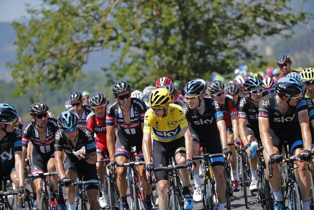 Riders talk as the pack with Britain's Chris Froome, wearing the overall leader's yellow jersey, took it easy during the sixteenth stage of the Tour de France cycling race over 201 kilometers (124.9 miles) with start in Bourg-de-Peage and finish in Gap, France, Monday, July 20, 2015. (AP Photo/Christophe Ena) Riders talk as the pack with Britain's Chris Froome, wearing the overall leader's yellow jersey, took it easy during the sixteenth stage of the Tour de France cycling race over 201 kilometers (124.9 miles) with start in Bourg-de-Peage and finish in Gap, France, Monday, July 20, 2015. (AP Photo/Christophe Ena)
