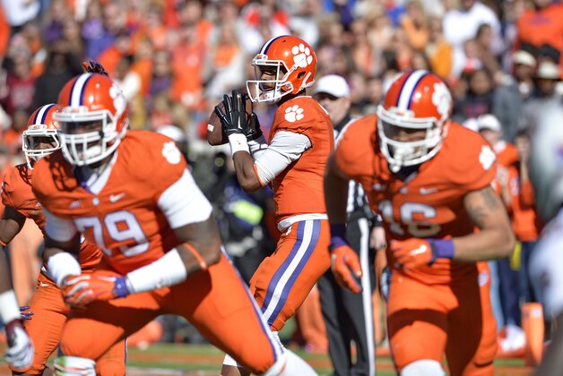Clemson quarterback Deshaun Watson drops pack to pass during the first half of an NCAA college football game against South Carolina in Clemson, S.C.,  Saturday, Nov. 29, 2014. Clemson won 35-17. (AP Photo/Richard Shiro)