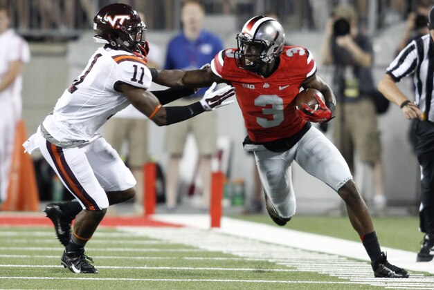Ohio State receiver Michael Thomas, right, tries to get around Virginia Tech cornerback Kendall Fuller during an NCAA college football game Saturday, Sept. 6, 2014, in Columbus, Ohio. Virginia Tech won 35-21. (AP Photo/Paul Vernon)