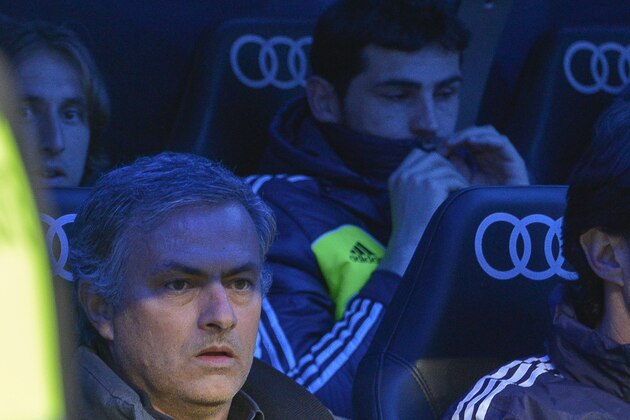 Real Madrid's Portuguese coach Jose Mourinho (L) and Real Madrid's goalkeeper and captain Iker Casillas (R) look on during the Spanish league football match Real Madrid vs Real Sociedad at the Santiago Bernabeu stadium in Madrid on January 6, 2013.   AFP PHOTO / PEDRO ARMESTRE        (Photo credit should read PEDRO ARMESTRE/AFP/Getty Images)