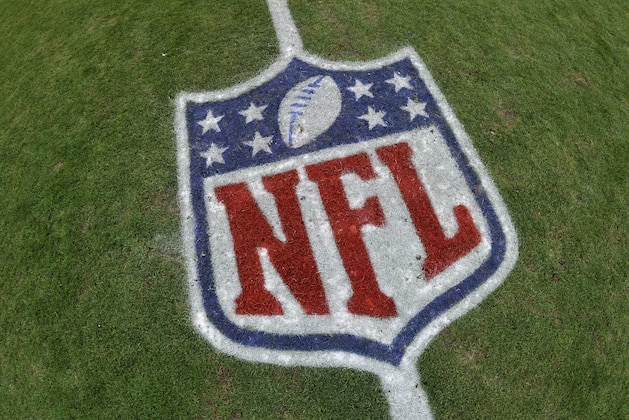 A detail view of an NFL logo painted on the playing field  before an NFL football game between the Cleveland Browns and the Cincinnati Bengals Sunday, Dec. 14, 2014, in Cleveland. Cincinnati won 30-0. (AP Photo/David Richard)