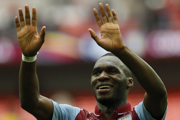Aston Villa’s Christian Benteke celebrates after the end of the  English FA Cup semifinal soccer match between Liverpool and  Aston Villa at Wembley Stadium in London, Sunday, April 19, 2015. Aston Villa won the game 2-1.(AP Photo/Kirsty Wigglesworth)
