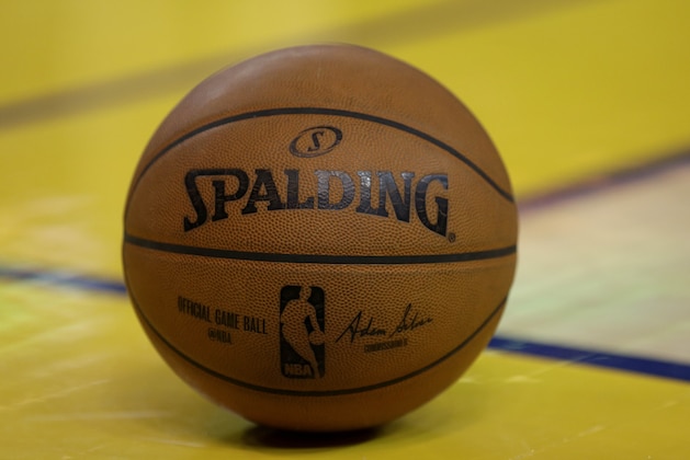 A Spalding game basketball is shown on the floor during the second half of Game 1 of the NBA basketball Western Conference finals between the Golden State Warriors and the Houston Rockets in Oakland, Calif., Tuesday, May 19, 2015. (AP Photo/Ben Margot)