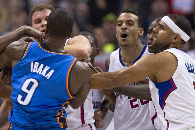 Los Angeles Clippers Matt Barnes (2R) and Oklahoma City Thunder Serge Ibaka (L) skirmish in the final seconds of the second quarter, during NBA action, November 13, 2013 in Los Angeles, California.  At far left is the Clippers Blake Griffin and at right is the Clippers Jared Dudley.  The Los Angeles Times reported November 14, 2013 that in the final seconds of the second quarter of Wednesday's game between the Clippers and the Oklahoma City Thunder, Blake Griffin and Serge Ibaka got their arms entangled while trying to grab a rebound. They wrestled for a few seconds, then Matt Barnes intervened and shoved Ibaka, who responded by trying to push Barnes while apparently preparing to throw a punch.  After Barnes left the court, he sent this tweet from the locker room, which was later taken down because it included an epithet and a curse word: 'I love my teammates like family, but I'm DONE standing up for these ...! All this ... does is cost me money.' Doc Rivers said he was disappointed by Barnes' words after the
