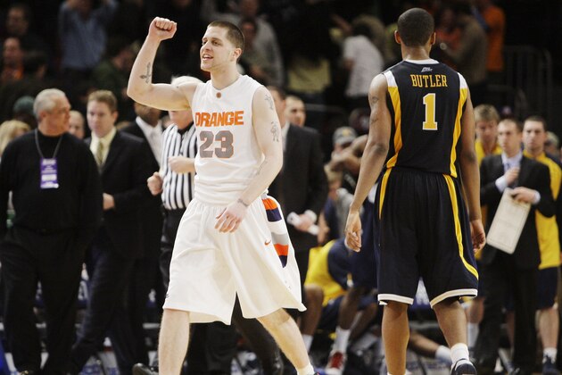 Syracuse's Eric Devendorf, left, celebrates as he and West Virginia's Da'Sean Butler (1) walk off the court at the end of overtime after Syracuse beat West Virginia 74-69 in a semifinal NCAA college basketball game at the Big East men's tournament Friday, March 13, 2009 at Madison Square Garden in New York. (AP Photo/Julie Jacobson)