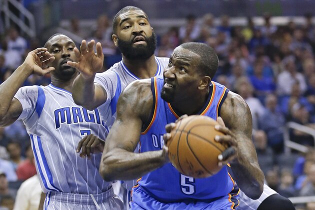 Oklahoma City Thunder's Kendrick Perkins (5) looks for a shot as he is guarded by Orlando Magic's Ben Gordon, left, and Kyle O'Quinn, center, during the first half of an NBA basketball game, Sunday, Jan. 18, 2015, in Orlando, Fla. (AP Photo/John Raoux)