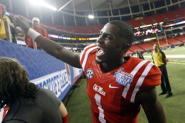 Mississippi wide receiver Laquon Treadwell celebrates with fans after Mississippi defeated Boise State 35-13 in an NCAA college football game Thursday, Aug. 28, 2014, in Atlanta. (AP Photo/John Bazemore)