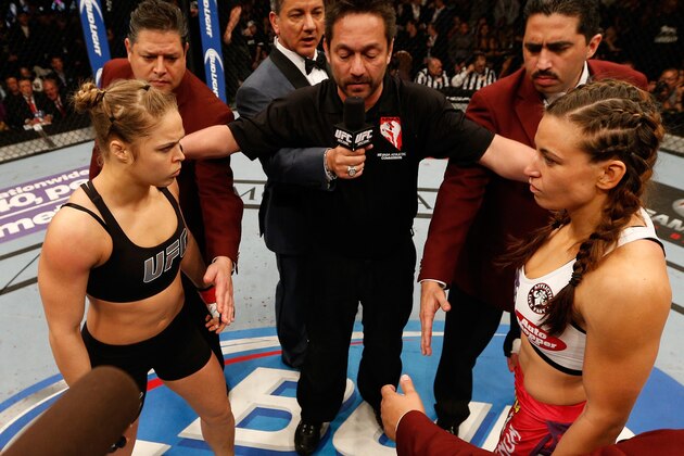 LAS VEGAS, NV - DECEMBER 28:  Ronda Rousey (left) and Miesha Tate (right) face off before their UFC women's bantamweight championship bout during the UFC 168 event at the MGM Grand Garden Arena on December 28, 2013 in Las Vegas, Nevada. (Photo by Josh Hedges/Zuffa LLC/Zuffa LLC via Getty Images)