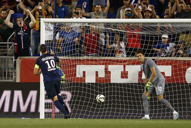Paris Saint-Germain forward Zlatan Ibrahimovic (10) scores past Fiorentina goalkeeper Ciprian Tataru?anu (12) in the second half during a soccer match in the International Champions Cup in Harrison N.J., Tuesday, July 21, 2015. Paris Saint-Germain won 4-2. (AP Photo/Rich Schultz)